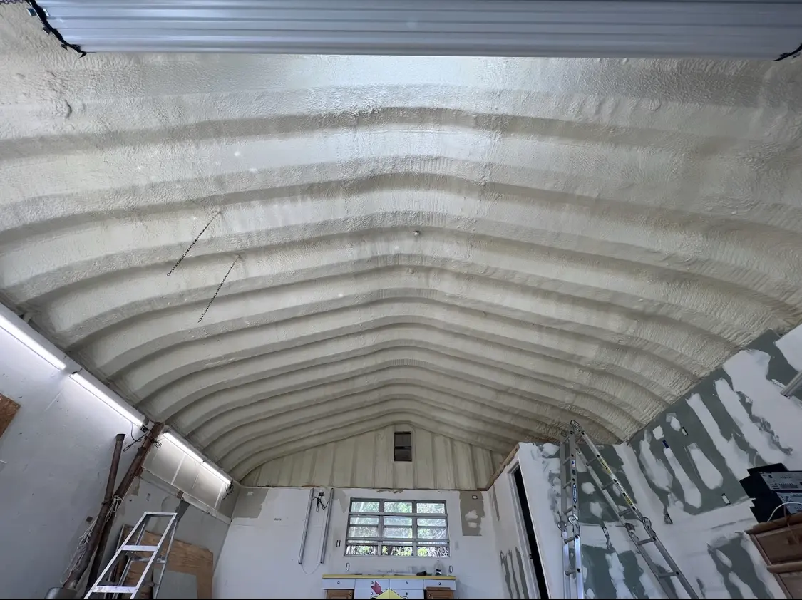 Spray polyurethane foam applied to the underside of a metal roof deck in North Canton